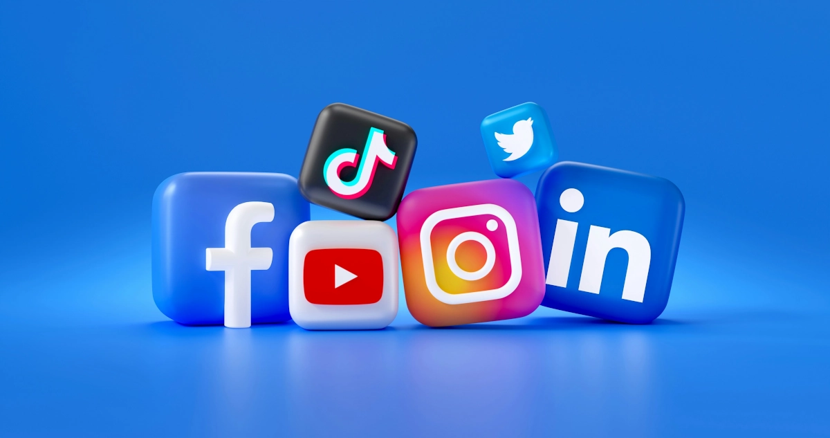 A group of social media logos, including Facebook, Instagram, LinkedIn, TikTok, Twitter, and YouTube on a blue background representing a successful social media strategy to drive business results.