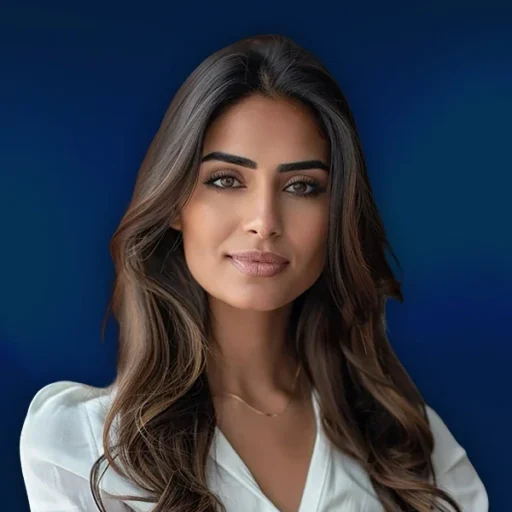 Professional woman with long hair, blue background.
