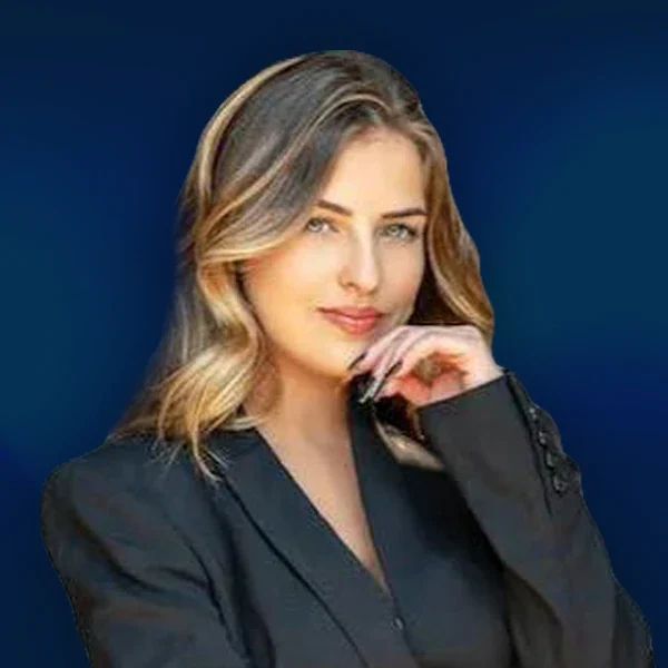Professional portrait of Emma, Director of Organic Search Strategy at AIWIZ, wearing a black blazer against a blue background, specialising in SEO and content-driven growth strategies.