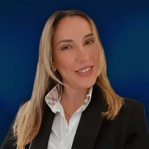 Smiling person in a business suit on blue background.