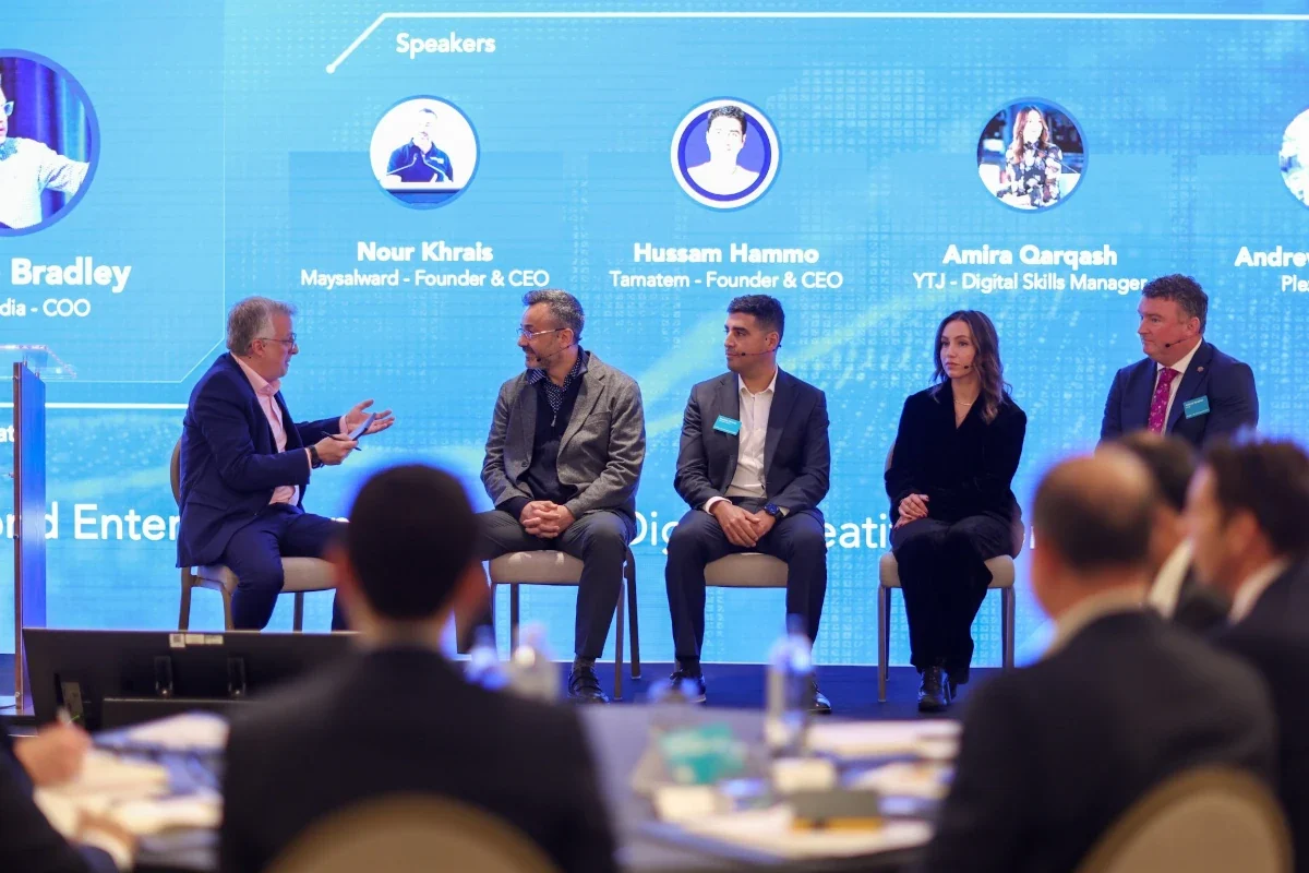 Jordan–UK Tech Connect 2025 in London: panel on AI, tech talent and the digital creative economy, five speakers on stage with the audience in view.